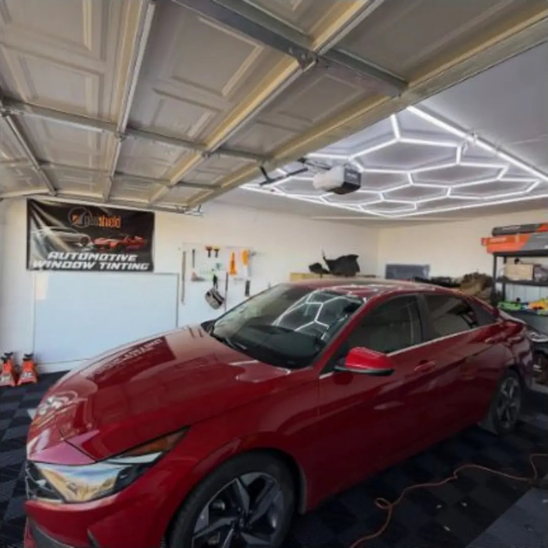 Finished red sedan with window tint installed by Chris